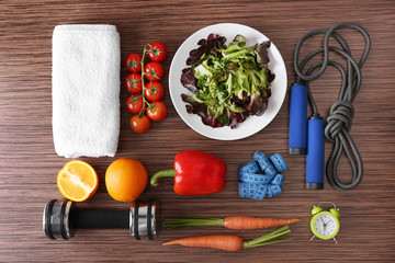 Workout and fitness dieting concept. Fitness equipment and healthy food
