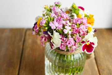 Beautiful meadow flowers in glass vase