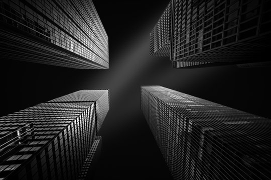 Fototapeta Architectural fine-art black and white photograph with four New York skyscrapers converging towards the sky