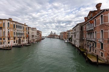 Fototapeta na wymiar View of the Grand Canal and the Santa Maria della Salute church from the Ponte dell'Accademia bridge