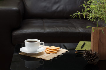 white coffee cup on glass table in living room