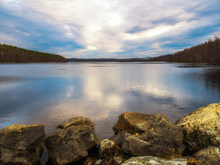 A large lake in the forest in autumn