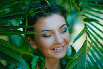 sensual portrait of young beautiful woman with jungle background