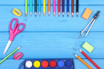 School and office accessories on blue boards, back to school concept, copy space for text