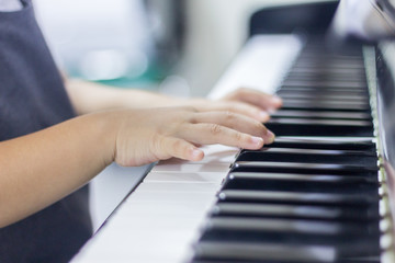 Obraz premium Children is playing piano