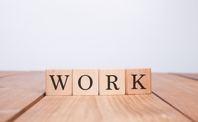 The word WORK over wood background