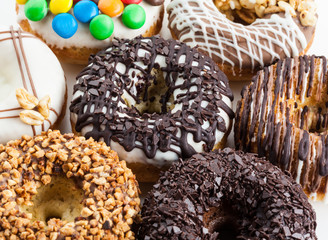 various donuts on white background