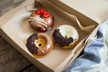 Colorful donuts in box