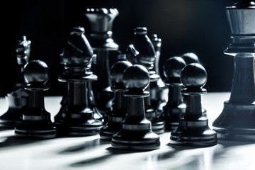 chess pieces on a black background