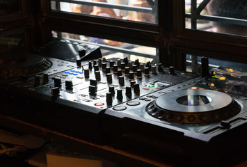 Djs table with audio equipment
