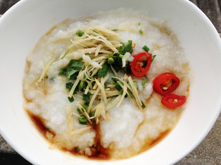asian food - a bowl of congee with minced pork on grunge background

keyword