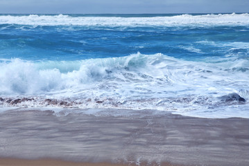 Blue sea texture with waves and foam