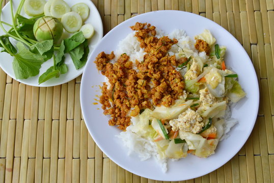 stir fried cabbage with egg and spicy minced pork curry paste on rice