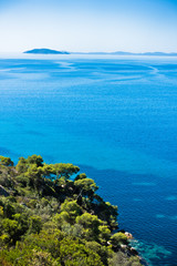 Greek mediterranean coast with beautiful blue tones of Aegean sea in Sithonia, Greece
