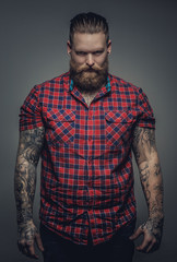 Fototapeta premium Tattooed male in a red shirt.
