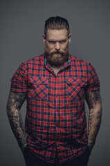 Fototapeta premium Tattooed male in a red shirt.