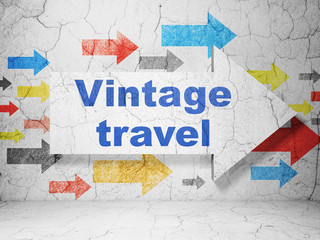 Vacation concept: arrow with Vintage Travel on grunge wall background