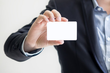 man holding white business card - for write the message in card.