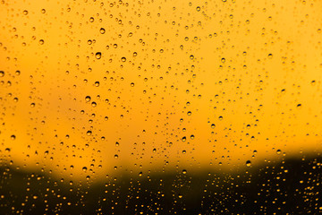 Water drop on glass mirror abstract background.