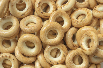 Wooden rustic table with national russian bagels. A group of bagels on a blue wooden table, top view
