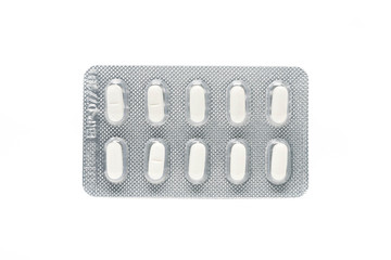 white pils tablets in blister pack isolated on white background.