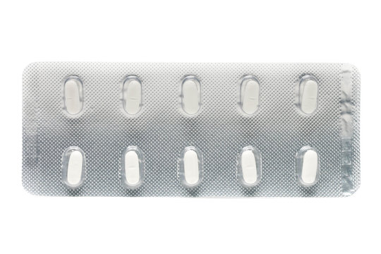 white pils tablets in blister pack isolated on white background.