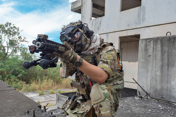 Man are playing of BB gun combat warrior style soldier at the battlefield