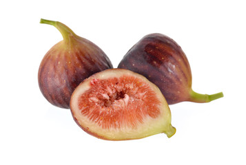 whole and half cut ripe fig with stem on white background
