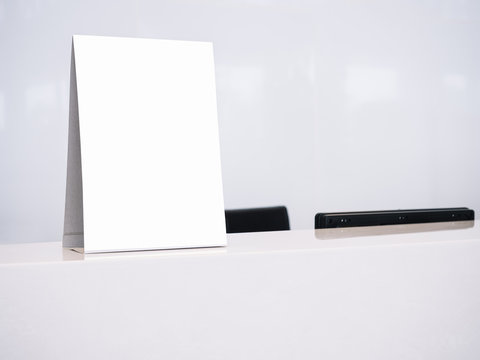 Mock up White template Menu frame on Table Counter Office Business Background