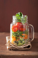 healthy vegetable salad in mason jar. tomato, broccoli, carrot,