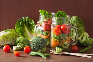 healthy vegetable salad in mason jar. tomato, broccoli, carrot,