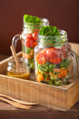 healthy vegetable salad in mason jar. tomato, broccoli, carrot,