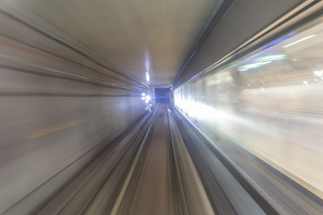 Fototapeta na wymiar Subway tunnel with blurred light tracks in the gallery - Concept