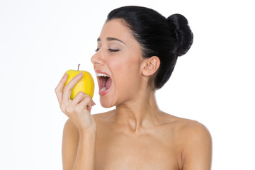 woman eating yellow apple