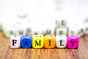 Wood dice with Words FMAILY mean Father And Mother I Love You