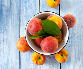 ripe peaches on wooden surface