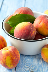 ripe peaches on wooden surface