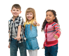 three smiling little children standing together isolated on white background