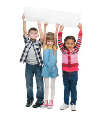 Obraz premium three children with open mouths holding empty sheet of paper isolated on white background
