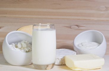 Obraz na płótnie Canvas Dairy products: milk, yogurt, cheese, butter on wooden backgroun