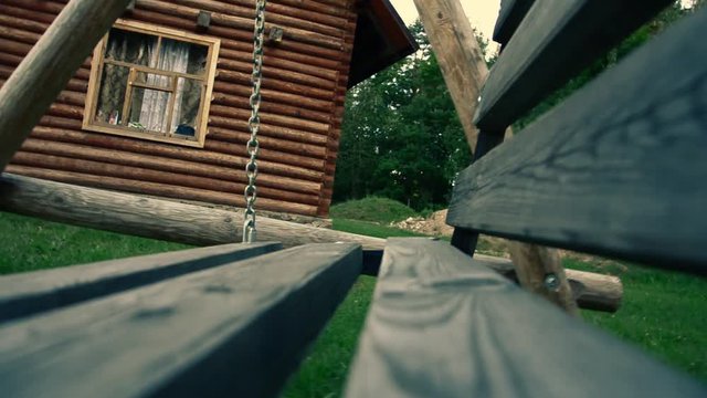 Old swing in the yard with light effect. weirdness