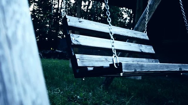 Old swing in the yard with light effect. weirdness