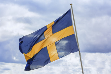 Sweden flag. Sweden flag with blue sky on background