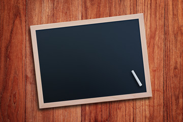 Black chalkboard on wood table