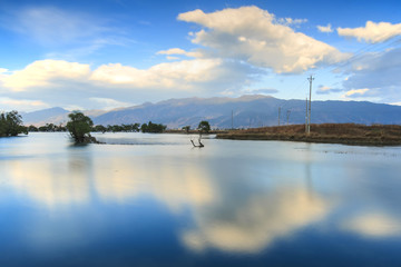 Sunset over one of the many lakes in the village of Heqing in Yunnan, China