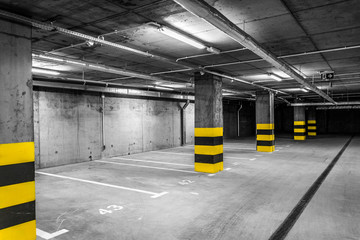 Mysterious black and white underground  garage with yellow details - obrazy, fototapety, plakaty