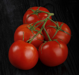 tomatos on wooden background