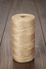 Fototapeta na wymiar reel of durable thread on the wooden table