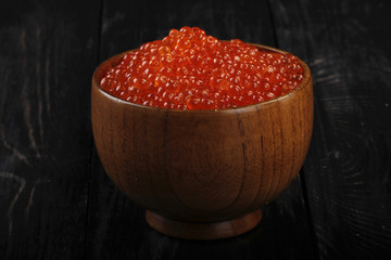 red caviar on wooden background