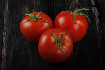 tomatos on wooden background